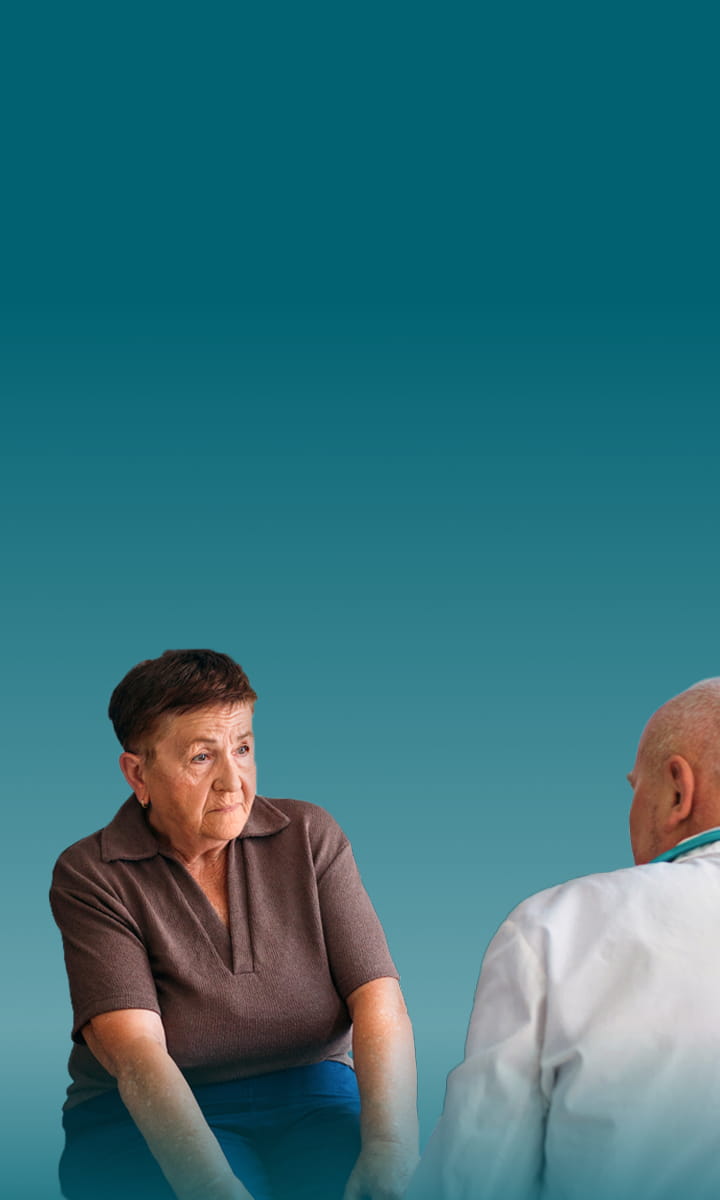 Actor portrayals of an older male experiencing Pseudobulbar Affect (PBA) crying symptoms, next to a younger female holding playing cards